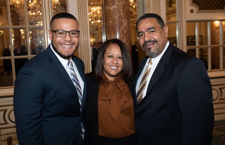 Joseph Diaz (left) with his parents